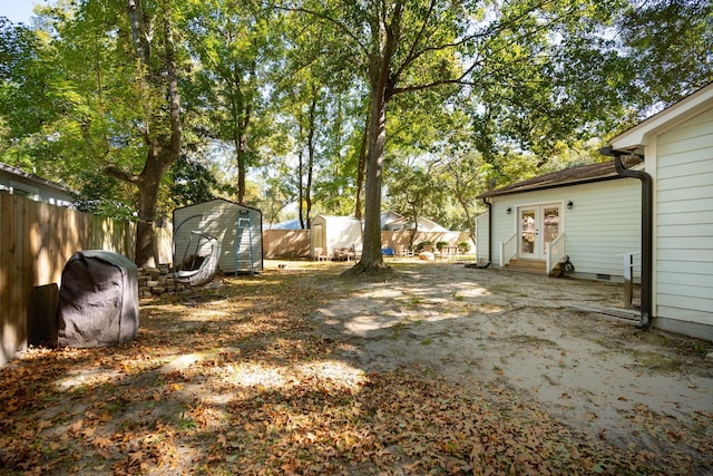 view of yard featuring french doors