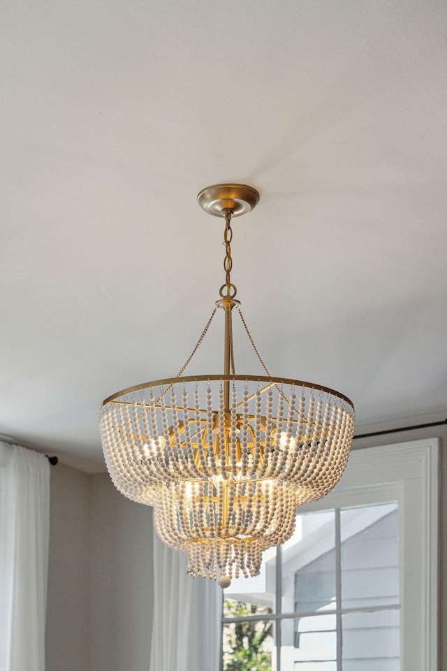 interior details featuring a chandelier