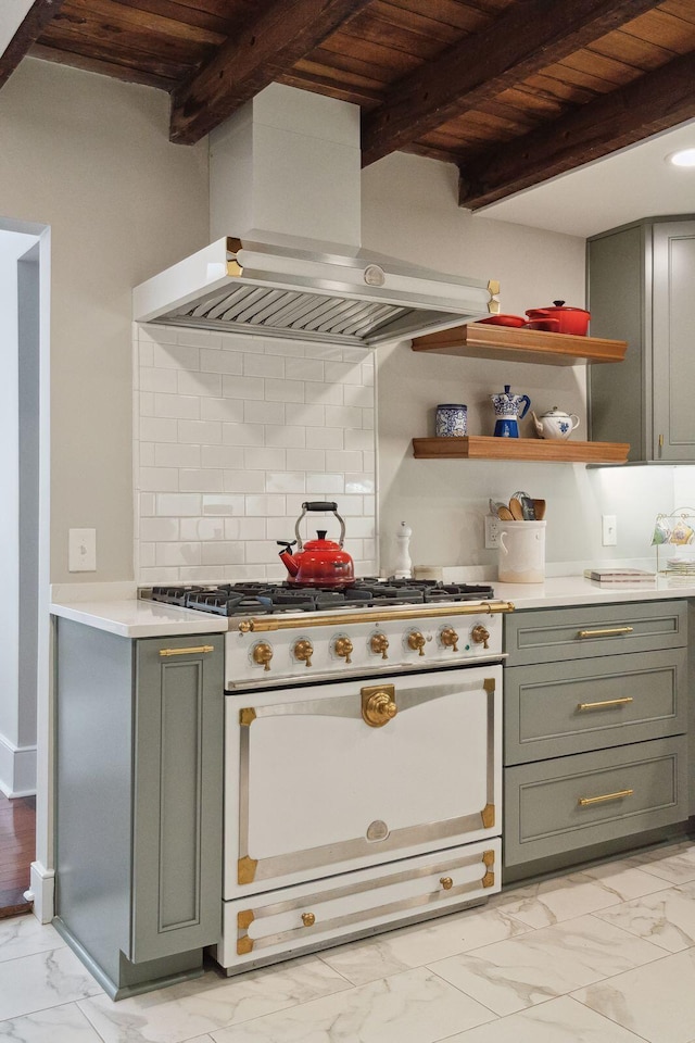 kitchen with marble finish floor, beamed ceiling, white range oven, and ventilation hood