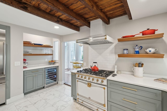 kitchen with marble finish floor, white range, custom exhaust hood, light countertops, and beverage cooler