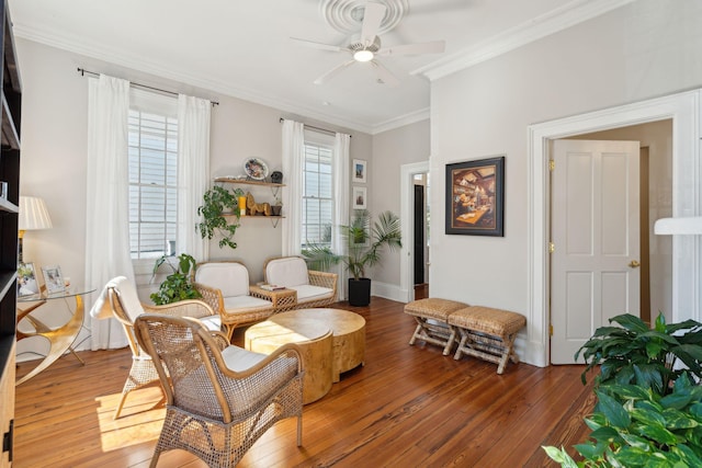 sitting room with ornamental molding, ceiling fan, and hardwood / wood-style floors