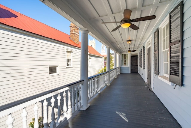 exterior space featuring covered porch and a ceiling fan