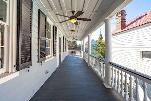 deck featuring a porch and a ceiling fan