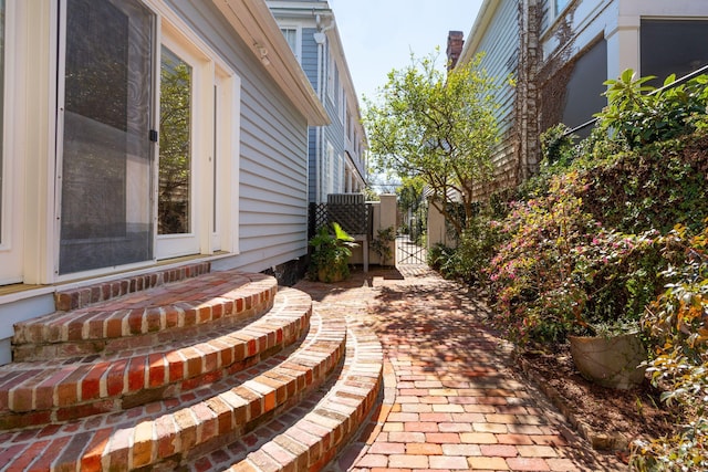 view of patio featuring entry steps and a gate