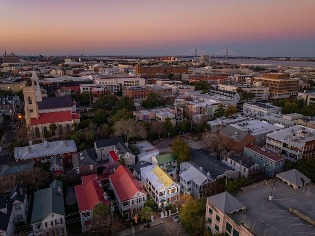 aerial view at dusk featuring a view of city