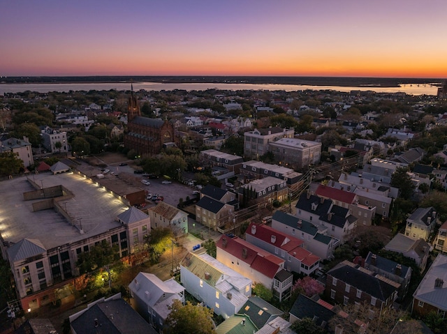 aerial view at dusk with a water view