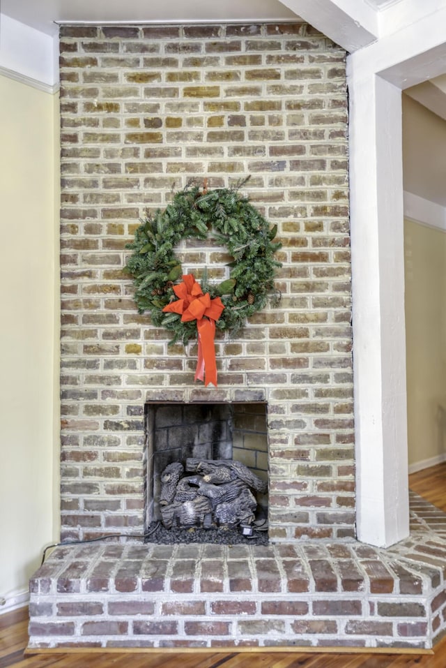 interior details with hardwood / wood-style floors and a fireplace