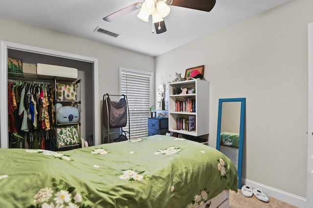 bedroom featuring a ceiling fan, visible vents, baseboards, carpet floors, and a closet