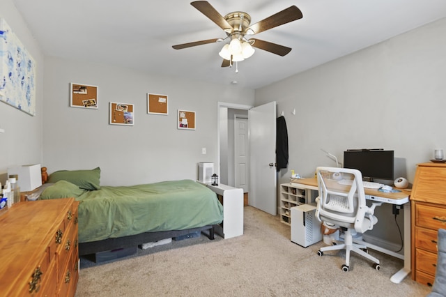 bedroom featuring a ceiling fan and light colored carpet