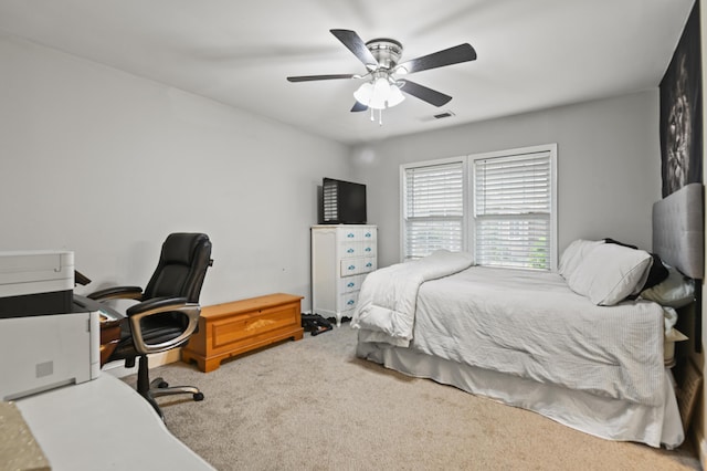 bedroom with visible vents, carpet floors, and ceiling fan