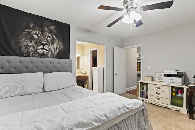 bedroom featuring carpet flooring, connected bathroom, and ceiling fan