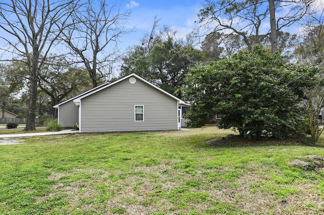 view of home's exterior with a lawn