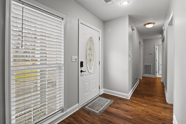 entryway with visible vents, baseboards, and wood finished floors