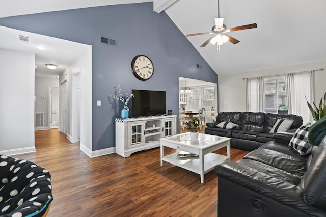 living room with visible vents, wood finished floors, and ceiling fan with notable chandelier