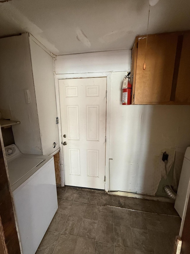 clothes washing area with cabinet space and washer / clothes dryer