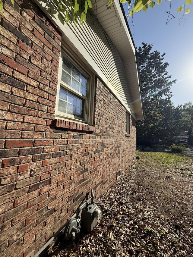 view of home's exterior with brick siding