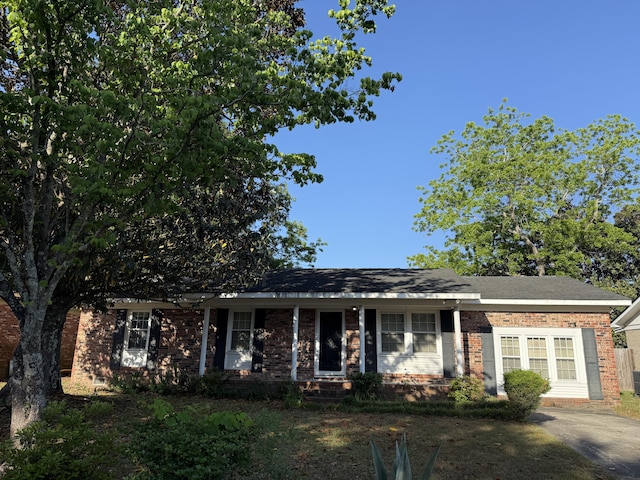 single story home with brick siding