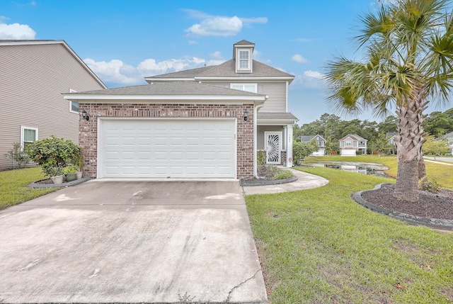 view of front of house with a garage and a front lawn