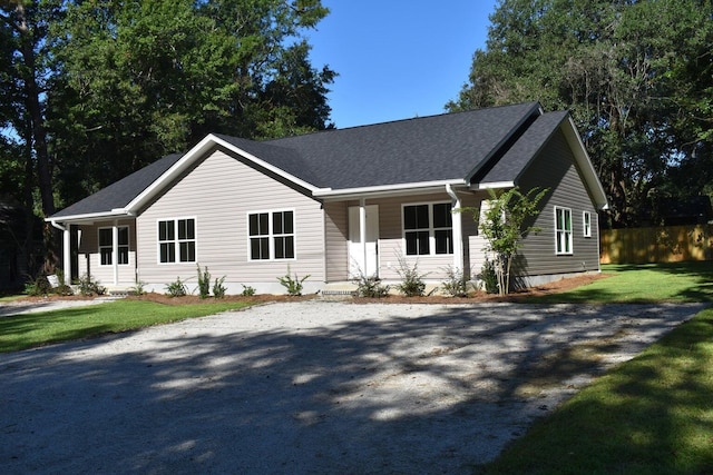 single story home with covered porch