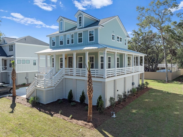 view of front facade with covered porch and a front lawn