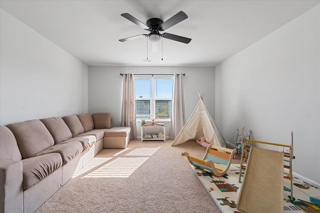 recreation room featuring ceiling fan and carpet flooring