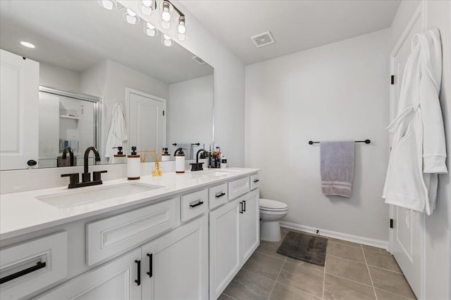 bathroom featuring vanity, an enclosed shower, tile patterned floors, and toilet