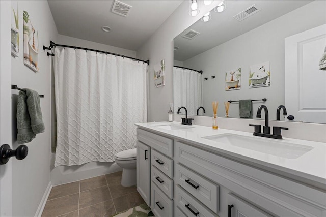 full bathroom featuring tile patterned flooring, vanity, shower / bath combo, and toilet