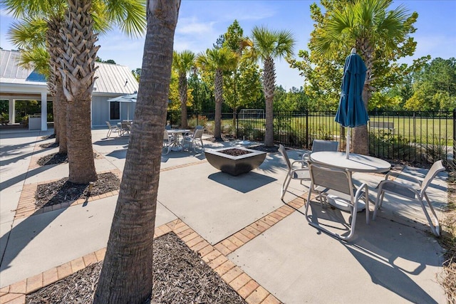 view of patio / terrace featuring a fire pit