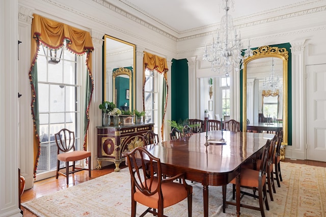 dining space with a notable chandelier and wood-type flooring