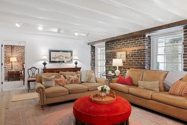 living room featuring brick wall, beam ceiling, and hardwood / wood-style floors