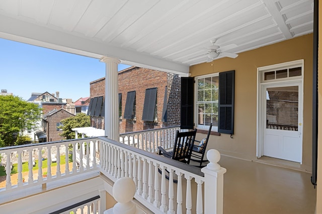 balcony with ceiling fan and a porch