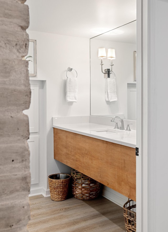 bathroom with vanity and hardwood / wood-style floors