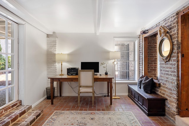 office space featuring beamed ceiling