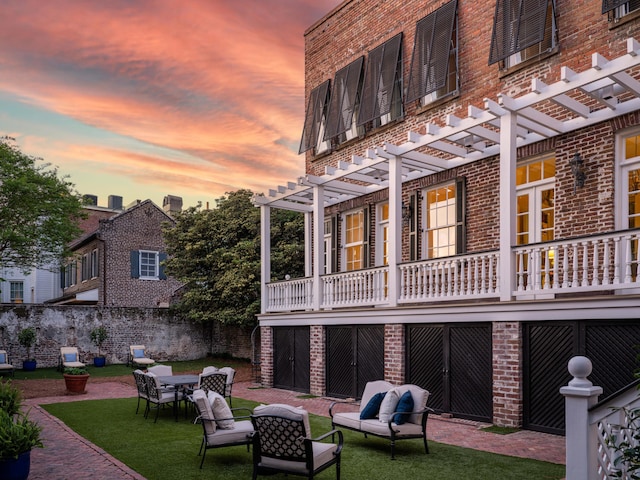 exterior space with a patio, a lawn, and a pergola