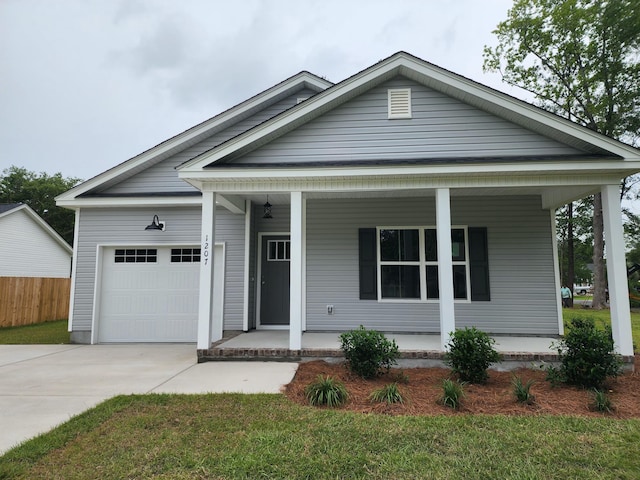 1207 Albert Storm Ave, Moncks Corner, SC 29461 - view of front of house featuring a porch, a garage, and driveway