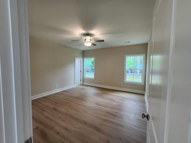 1207 Albert Storm Ave, Moncks Corner, SC 29461 - spare room featuring wood finished floors, a ceiling fan, and baseboards