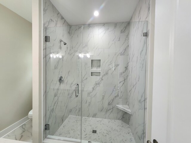 1207 Albert Storm Ave, Moncks Corner, SC 29461 - bathroom with marble look tile flooring, a marble finish shower, toilet, baseboards, and recessed lighting