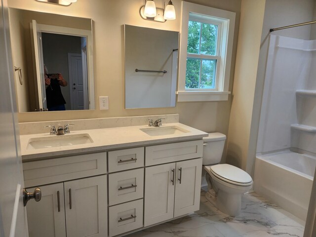 1207 Albert Storm Ave, Moncks Corner, SC 29461 - full bath featuring marble look tile flooring, double vanity, toilet, and shower / tub combination