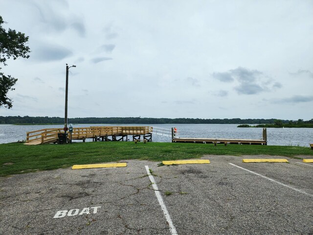 1207 Albert Storm Ave, Moncks Corner, SC 29461 - uncovered parking lot featuring a boat dock and a water view