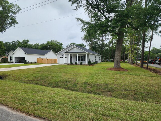 1207 Albert Storm Ave, Moncks Corner, SC 29461 - view of front facade with driveway, an attached garage, and covered porch