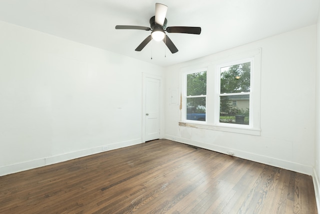 unfurnished room featuring ceiling fan and dark hardwood / wood-style floors