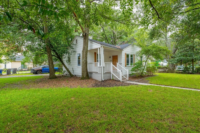 view of front of home featuring a front lawn and a porch