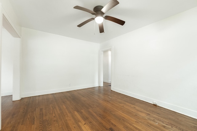 unfurnished room with dark wood-type flooring and ceiling fan