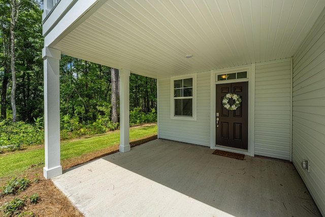 entrance to property featuring a patio area