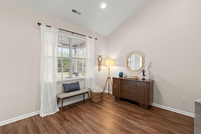 sitting room with dark hardwood / wood-style floors and high vaulted ceiling