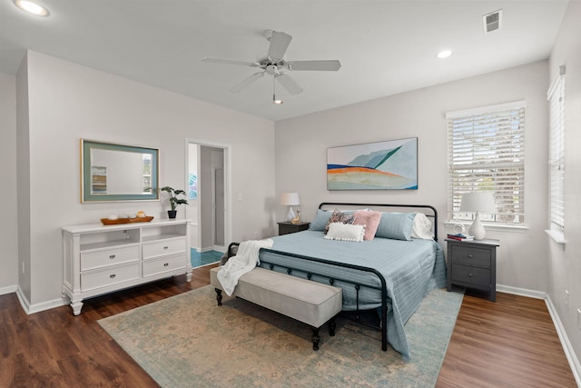 bedroom featuring ceiling fan and dark hardwood / wood-style flooring