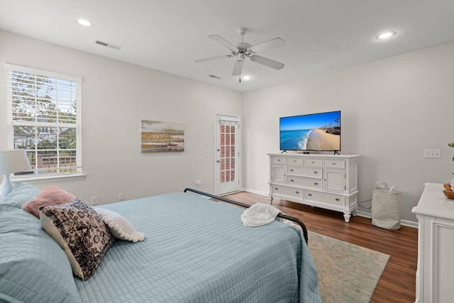 bedroom featuring ceiling fan and dark hardwood / wood-style flooring