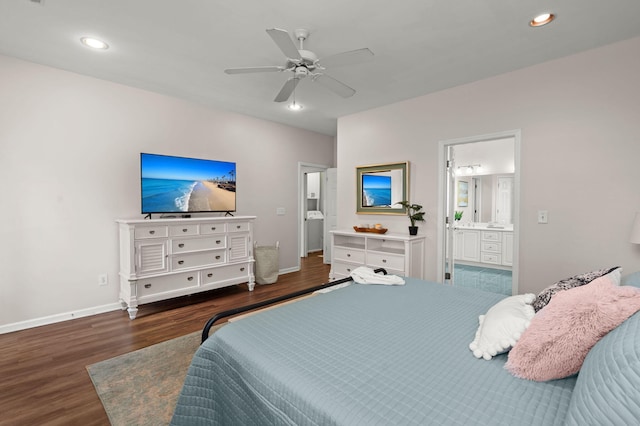 bedroom featuring washer / dryer, dark hardwood / wood-style flooring, ensuite bathroom, and ceiling fan