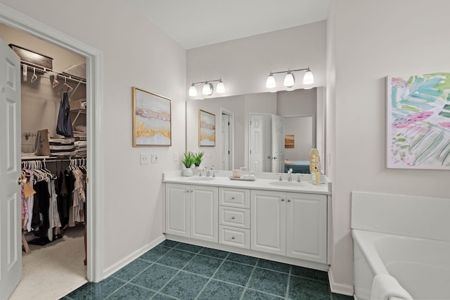 bathroom with vanity and a tub to relax in