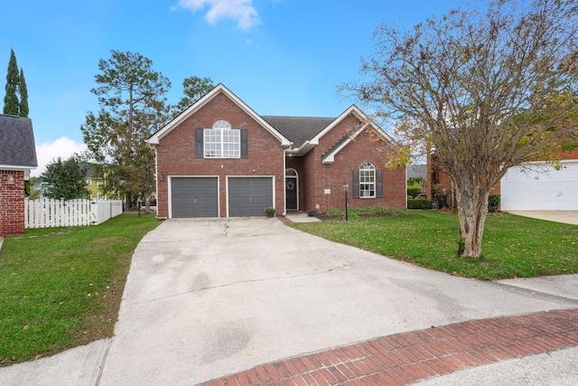 view of property with a front lawn and a garage